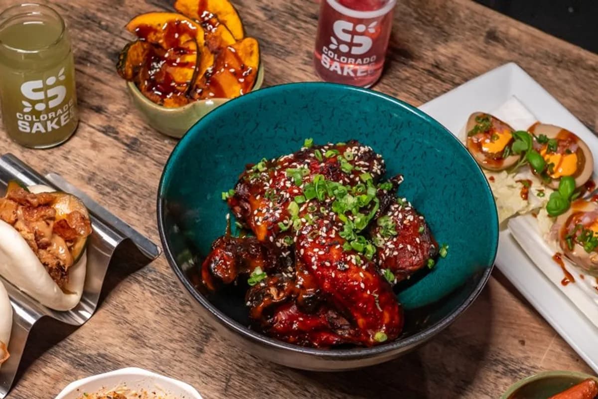 Japanese-inspired small plates — glazed wings, bao buns, and craft sake