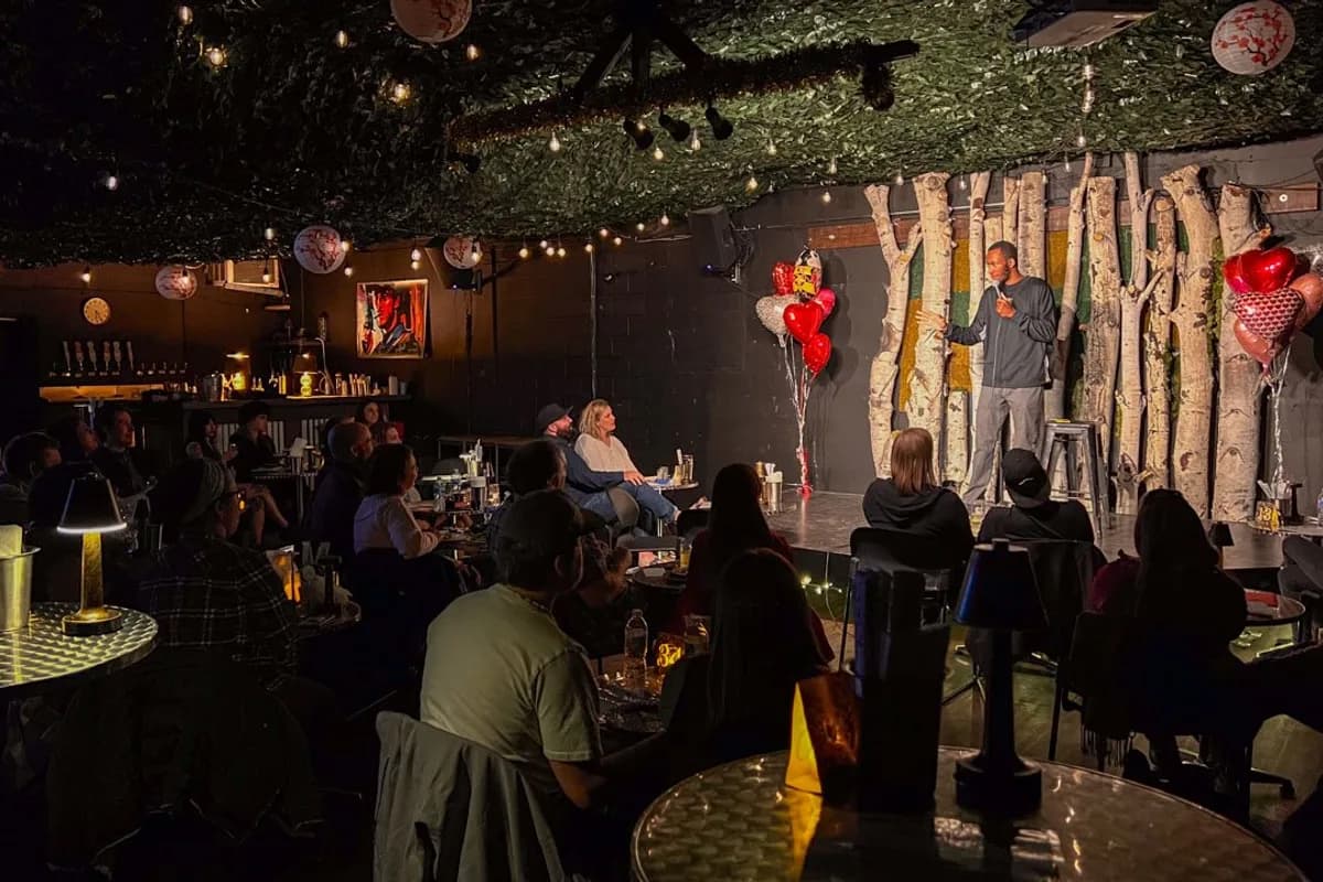 Denver Comedy Lounge interior — intimate comedy venue with blue stage lighting